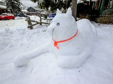 A giant snow cat sculpted on a lawn on 51st. Ave. in the Lachine borough of Montreal on Jan. 18, 2021.