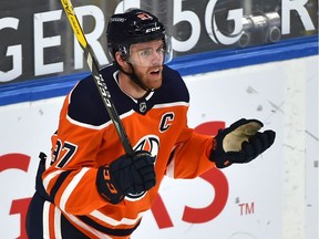 Edmonton Oilers' Connor McDavid reacts after getting called for hooking against the Montreal Canadiens at Rogers Place in Edmonton on Jan. 18, 2021.