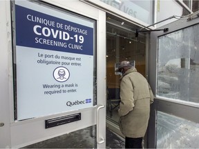 A man enters a COVID-19 testing facility in Kirkland on Jan. 21, 2021.