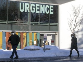 People walk by the emergency entrance of Maisonneuve-Rosemont Hospital in Montreal Jan. 20, 2021.