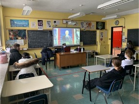 Students at Westmount High School watch the inauguration of U.S. President Joe Biden on Jan. 20, 2021.