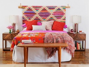 Hanging a rug as a headboard is an alternative way to reuse an area rug. Panja Rug, CB2.