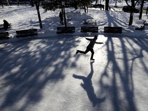 A man enjoys the bright afternoon sun to get some ice time in at Molson Park in Montreal, on Jan. 25, 2021.
