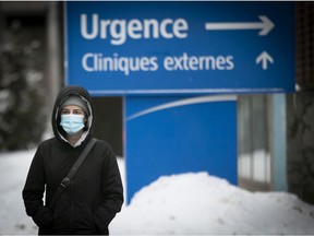 A person walks past the emergency entrance of the Jean-Talon hospital in Montreal.