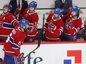 Montreal Canadiens' Shea Weber (6) celebrates his goal as he stakes by his teammates, after scoring the Habs second goal against the Calgary Flames, during first period NHL action in Montreal on Thursday, January 28, 2021.