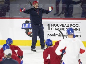 Laval Rocket head coach Joël Bouchard with his players at practice last year before the pandemic ended the AHL season prematurely.