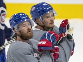 Linemates Paul Byron (left) and Artturi Lehkonen wait their turn during a Canadiens training-camp drill at the Bell Sports Complex in Brossard.