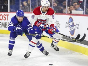 Montreal Canadiens prospect Joel Teasdale battles Toronto Maple Leafs' Rasmus Sandin during Rookie Challenge game in Laval on Sept. 9, 2018.