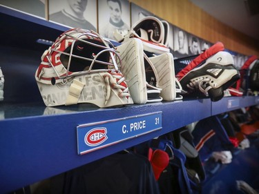Carey Price's mask and gloves sit above his stall in the dressing room at the Bell Sports Complex in Brossard on Tuesday April 9, 2019.