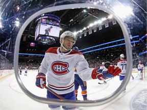 Max Domi #13 of the Montreal Canadiens flips the puck into his own glove during a break in the play against the New York Islanders at the Barclays Center on March 03, 2020 in the Brooklyn borough of New York City.