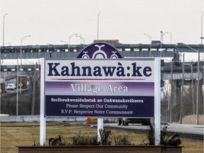 Sign at the entrance to the village area of Kahnawake, the Mohawk community at the foot of the Mercier Bridge.