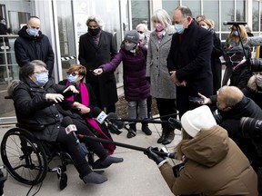 Federal Health Minister Patty Hajdu and Quebec Health Minister Christian Dubé listen as COVID-19 vaccination recipient Gloria Lallouz speaks to the media  at Maimonides in Montreal on Monday, Dec. 14, 2020.