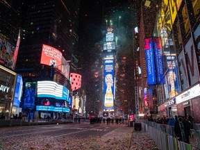 The New Year's Eve ball drops in a mostly empty Times Square in New York City.