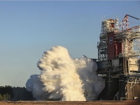 In this image provided by NASA, the core stage for the first flight of NASA's Space Launch System rocket is seen in the B-2 Test Stand during a scheduled eight minute duration hot fire test on Saturday, Jan. 16, 2021, at NASAs Stennis Space Center near Bay St. Louis, Miss. The four RS-25 engines fired for a little more than one minute. The hot fire test is the final stage of the Green Run test series, a comprehensive assessment of the Space Launch Systems core stage prior to launching the Artemis I mission to the Moon.