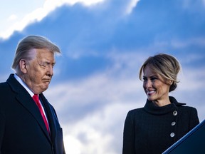President Donald Trump and First Lady Melania Trump speak to supporters before boarding Air Force One for his last time as president on January 20, 2021 in Joint Base Andrews, Maryland.