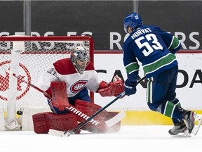 Bo Horvat scores the winning goal for the Canucks on Canadiens goalie Carey Price in 6-5 shootout victory Wednesday night in Vancouver.