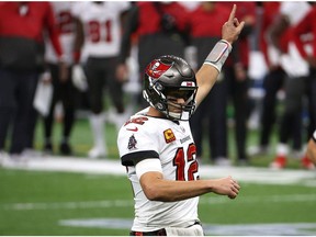 Tom Brady of the Tampa Bay Buccaneers points to the air against the New Orleans Saints during the fourth quarter in the NFC Divisional Playoff game at Mercedes Benz Superdome on Sunday, Jan. 17, 2021, in New Orleans.