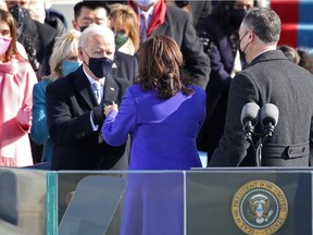 Vice President Kamala Harris greets President-elect Joe Biden after being sworn in by U.S. Supreme Court Associate Justice Sonia Sotomayor as her husband Doug Emhoff looks on at the inauguration of U.S. President-elect Joe Biden on the West Front of the U.S. Capitol on January 20, 2021 in Washington, DC.  During today's inauguration ceremony Joe Biden becomes the 46th president of the United States.