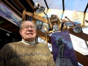 Artist Tex Dawson sits in his studio in 2005, surrounded by his paintings of the 60th anniversary of WWII.