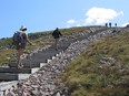 Hikers make their way up the stairs to the plateau of Mont Jacques Cartier, in the Parc National de la Gaspésie.