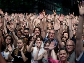The crowd waves towards the stage for Charlotte Cardin's crew to send out a social media picture before she performs the opening concert of the Montreal International Jazz Festival in Montreal, on Thursday, June 27, 2019. Montreal is a cosmopolitain city, and diversity is an asset, not a flaw to be stamped out, Tom Mulcair says.