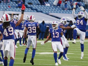 The Buffalo Bills celebrate a 27-24 win in the AFC Wild Card playoff game against the Indianapolis Colts at Bills Stadium in Orchard Park, N,.Y., on Saturday, Jan. 9, 2021.