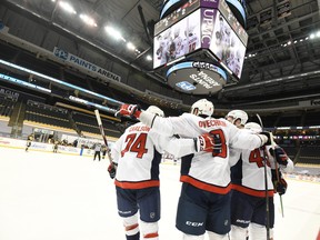 Washington Capitals wing Alex Ovechkin celebrates with teammates after a first period goal against the Pittsburgh Penguins at PPG Paints Arena in Pittsburgh, Pa., Jan. 19, 2021.