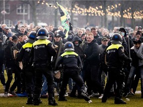 Anti-government activists face off with Dutch police during a protest to denounce continuing restrictions related to the coronavirus disease (COVID-19) pandemic in Museumplein, Amsterdam, on Sunday, Jan. 17, 2021.