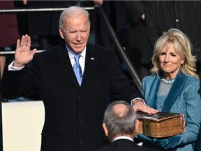 Joe Biden (L), flanked by incoming US First Lady Jill Biden is sworn in as the 46th US President by Supreme Court Chief Justice John Roberts on January 20, 2021, at the US Capitol in Washington, DC. "I listened with intent to his inauguration speech. In front of us stood a wise man, not an old man," Lise Ravary writes.