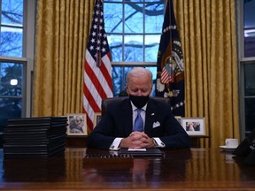 U.S. President Joe Biden sits in the Oval Office at the White House in Washington, D.C., after being sworn in at the U.S. Capitol on Jan. 20, 2021.