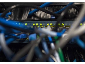 Network cables are seen going into a server in an office building in Washington, DC on May 13, 2017.  International investigators hunted on May 13 for those behind an unprecedented cyber-attack that affected systems in dozens of countries, including at banks, hospitals and government agencies, as security experts sought to contain the fallout. The assault, which began Friday and was being described as the biggest-ever cyber ransom attack, struck state agencies and major companies around the world -- from Russian banks and British hospitals to FedEx and European car factories.