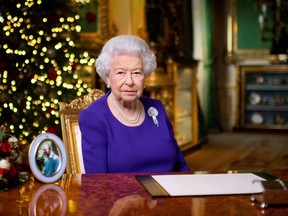 FILE PHOTO: Britain's Queen Elizabeth II records her annual Christmas broadcast in Windsor Castle in England, December 24, 2020. Victoria Jones/Pool via REUTERS/File Photo