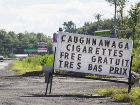 A  sign advertising cigarettes and tobacco products on Highway 132 just outside the Kahnawake Mohawk Territory in Montreal on July 9, 2014.
