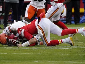 Kansas City Chiefs quarterback Patrick Mahomes (15) is brought down by Cleveland Browns outside linebacker Mack Wilson (51) during the second half in the AFC Divisional Round playoff game at Arrowhead Stadium on Sunday, Jan. 17, 2021, in Kansas City. Mahomes would suffer an injury on the play.
