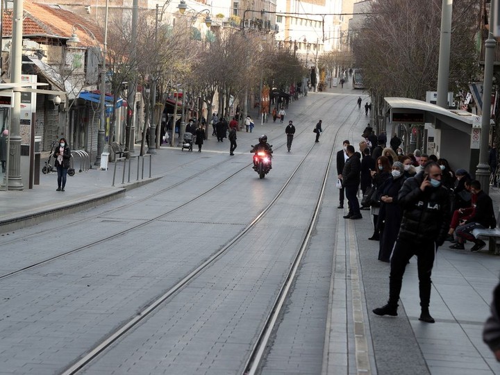  Policemen ride a motorbike as they patrol a main street in downtown Jerusalem after Israel imposed a third national lockdown to fight climbing coronavirus disease (COVID-19) infections December 28, 2020.