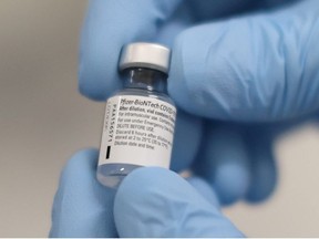 A vial of the Pfizer/BioNTech COVID-19 vaccine is seen ahead of being administered at the Royal Victoria Hospital in Belfast, Northern Ireland, Dec. 8, 2020.