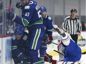 Canadiens' Joel Armia flies through the air after a hit by Canucks defenceman Tyler Myers Thursday night.