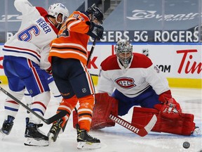 Canadiens goaltender Carey Price makes a save on Oilers forward Ryan Nugent-Hopkins (93) at Rogers Place in Edmonton on Saturday, Jan. 16, 2021.