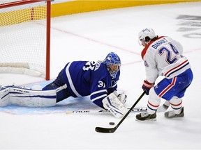 Maple Leafs goalie Frederik Andersen makes save on the Canadiens’ Phillip Danault during NHL season opener Wednesday night in Toronto.