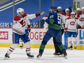 The Canadiens’ Joel Edmundson and the Canucks’ Tyler Myers drop the gloves and square off early in first period of Saturday night’s game in Vancouver.