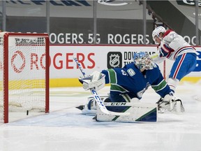 Canadiens forward Tyler Toffoli scores on Vancouver Canucks goalie Thatcher Demko in the second period in a game at Rogers Arena in Vancouver on Jan. 21, 2021.