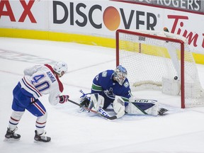 Jan 21, 2021; Vancouver, British Columbia, CAN; Montreal Canadiens forward Joel Armia (40) scores on Vancouver Canucks goalie Thatcher Demko (35) in the first period in a game at Rogers Arena. Mandatory Credit: Bob Frid-USA TODAY Sports