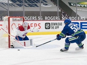 Montreal Canadiens goalie Jake Allen makes a save on Vancouver Canucks forward Bo Horvat during the third period at Rogers Arena in Vancouver. on Jan. 21, 2021.