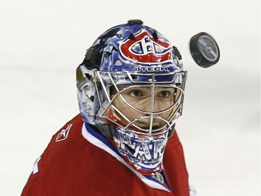 Carey Price of the Montreal Canadiens keeps his eye on the puck in a goal-mouth scramble in the second period against the Tampa Bay Lightning at the Bell Centre in Montreal Thursday, March 26, 2009.