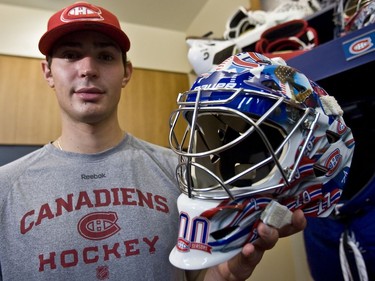 BROSSARD, QUE: September 16, 2009 - Canadiens goalie Carey Price with a new mask on Wednesday, September 16, 2009 in Brossard, designed and painted by Toronto-based artist David Arrigo, that he will wear for a portion of this season and later have auctioned for charity. Pictured atop the mask are former Habs goalies Gump Worsley and Ken Dryden and beneath them, the sweater numbers of defencemen who played in front of the two during their first Stanley Cup winning seasons in Montreal. But a production error has put Dryden, not the intended Jacques Plante, on one side of the mask. Price loves it, however, and the design will not be changed.