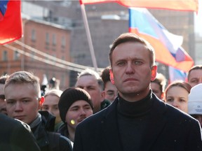 FILE PHOTO: Russian opposition politician Alexei Navalny takes part in a rally to mark the 5th anniversary of opposition politician Boris Nemtsov's murder and to protest against proposed amendments to the country's constitution, in Moscow, Russia February 29, 2020. REUTERS/Shamil Zhumatov/File Photo