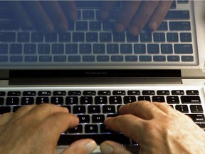 FILE - In this Feb. 27, 2013, file photo illustration, hands type on a computer keyboard in Los Angeles. Spring is a great time to clear out your digital clutter and make sure that you're adequately protected against hackers. A personal cybersecurity clean up should involve evaluating all your passwords, updating your software and taking stock of exactly where all your personal information is stored. (AP Photo/Damian Dovarganes, File) ORG XMIT: NYBZ240 ORG XMIT: POS1605040925503754