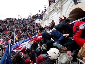 Pro-Trump protesters storm into the U.S. Capitol during clashes with police, during a rally to contest the certification of the 2020 U.S. presidential election results by the U.S. Congress, in Washington, on Jan. 6, 2021.