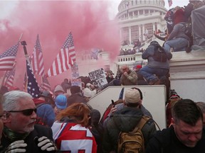 Insurrectionists storm the U.S. Capitol on Jan. 6. Canadian society, too, is fractured, André Pratte writes.