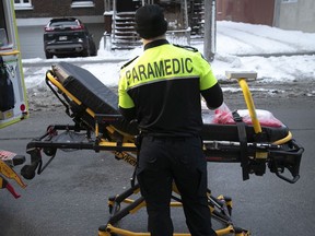 An Urgence Santé paramedic outside Jean-Talon Hospital.